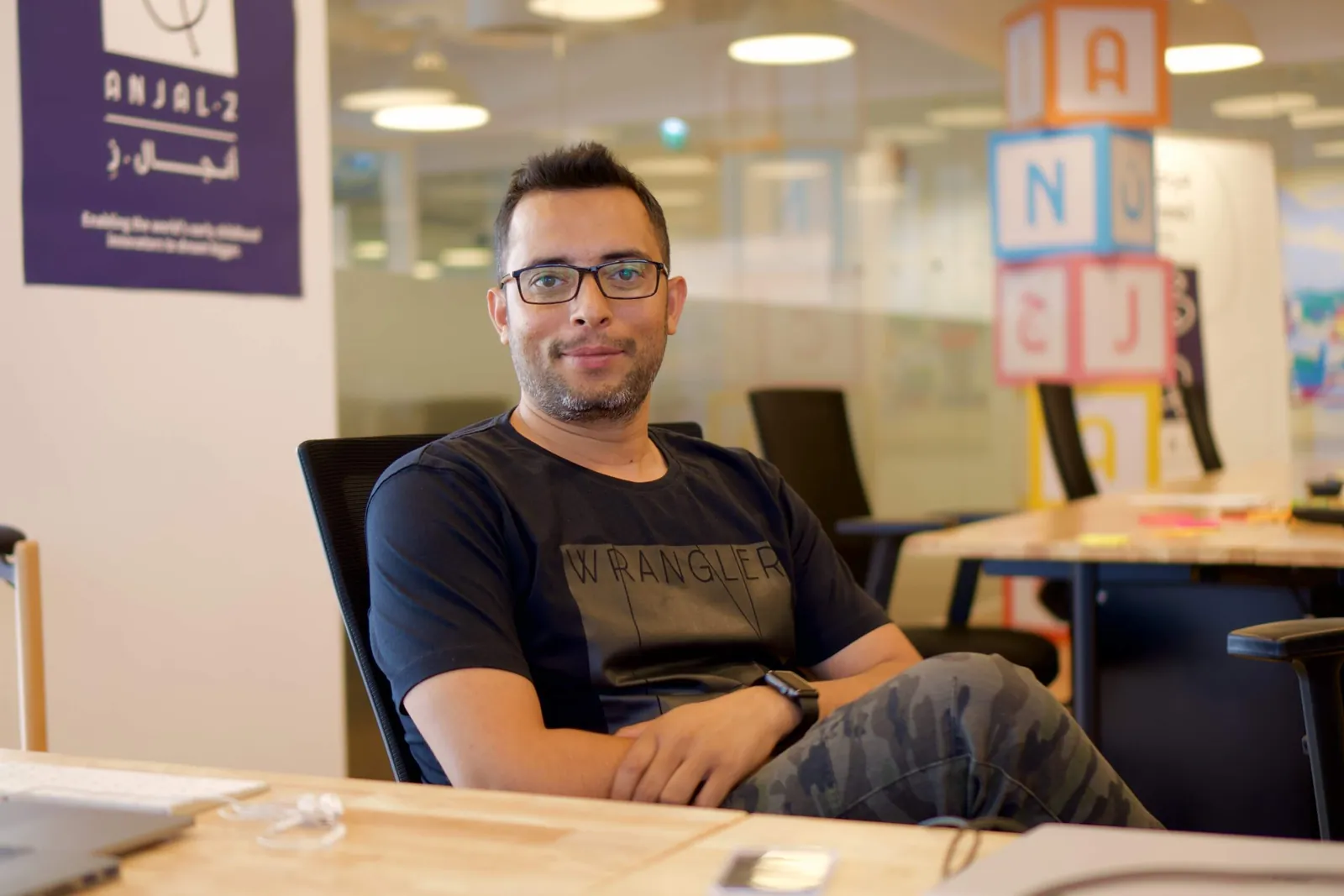 Atulesh at his desk in the office